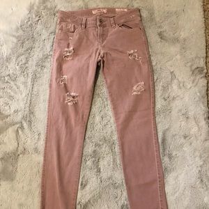 Pink distressed skinny jeans